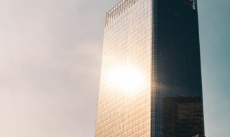 sun shining on skyscraper
