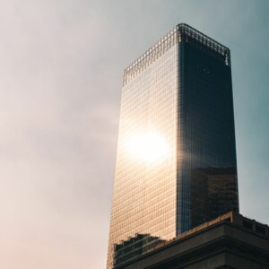 sun shining on skyscraper