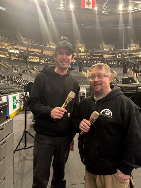 Brandi Carlile’s Monitor Engineer Jerry Streeter (L) and Front of House Engineer Sean Quackenbush (R) holding the custom gold Spectera handheld prototypes.